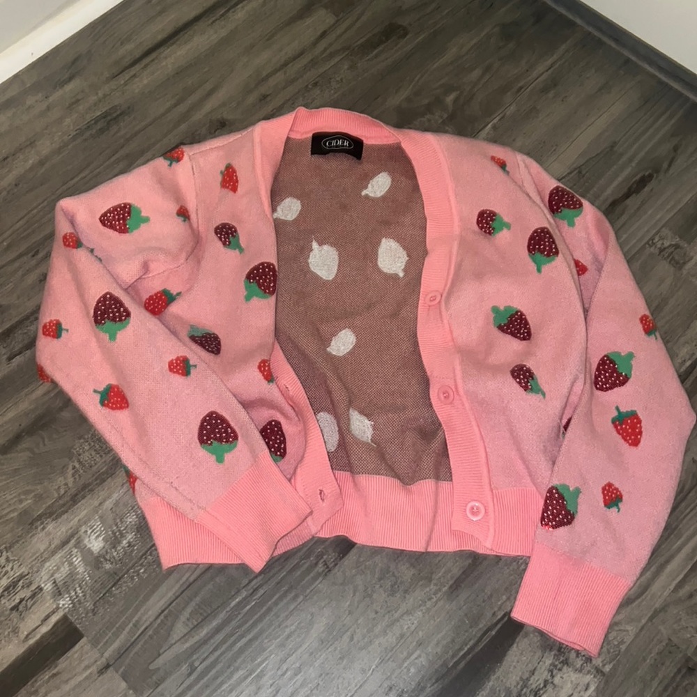 CIDER brand cardigan. pink with strawberry sequin designs. one size